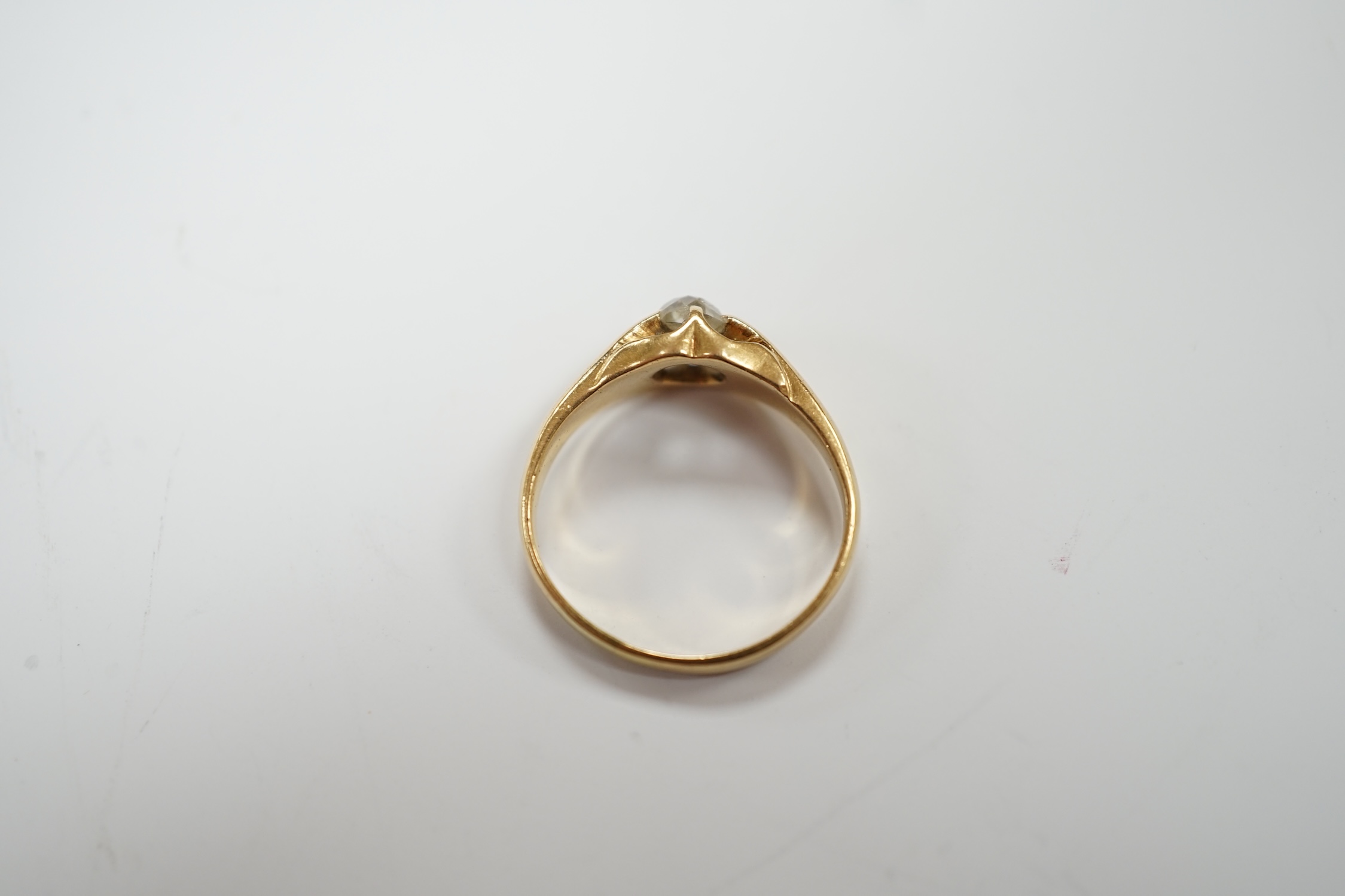 An 18ct gold and claw set solitaire diamond ring, size L, gross weight 3.5 grams.